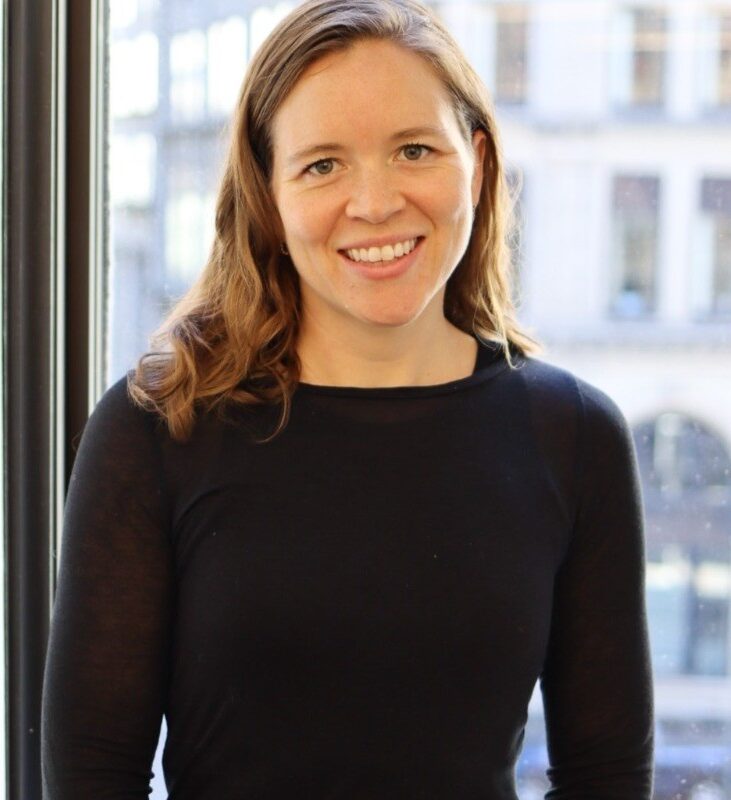 Adjunct Professor, Jackie Powell. Wearing a black business casual shirt.